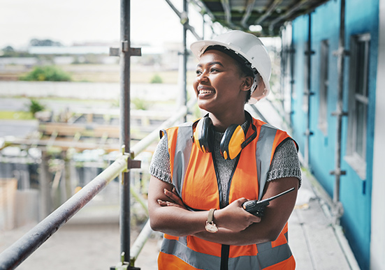 A young woman working at a construction site